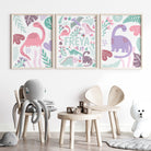 Set of 3 pink dinosaur wall art prints for nursery decor, featuring personalised designs, unframed.