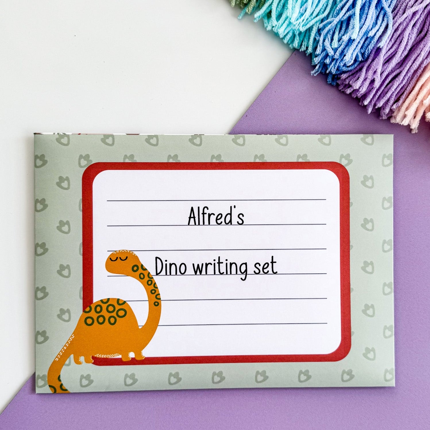 Eco-friendly and plastic-free green dinosaur stationery set for kids, designed to inspire creativity and letter writing while being kind to the planet.