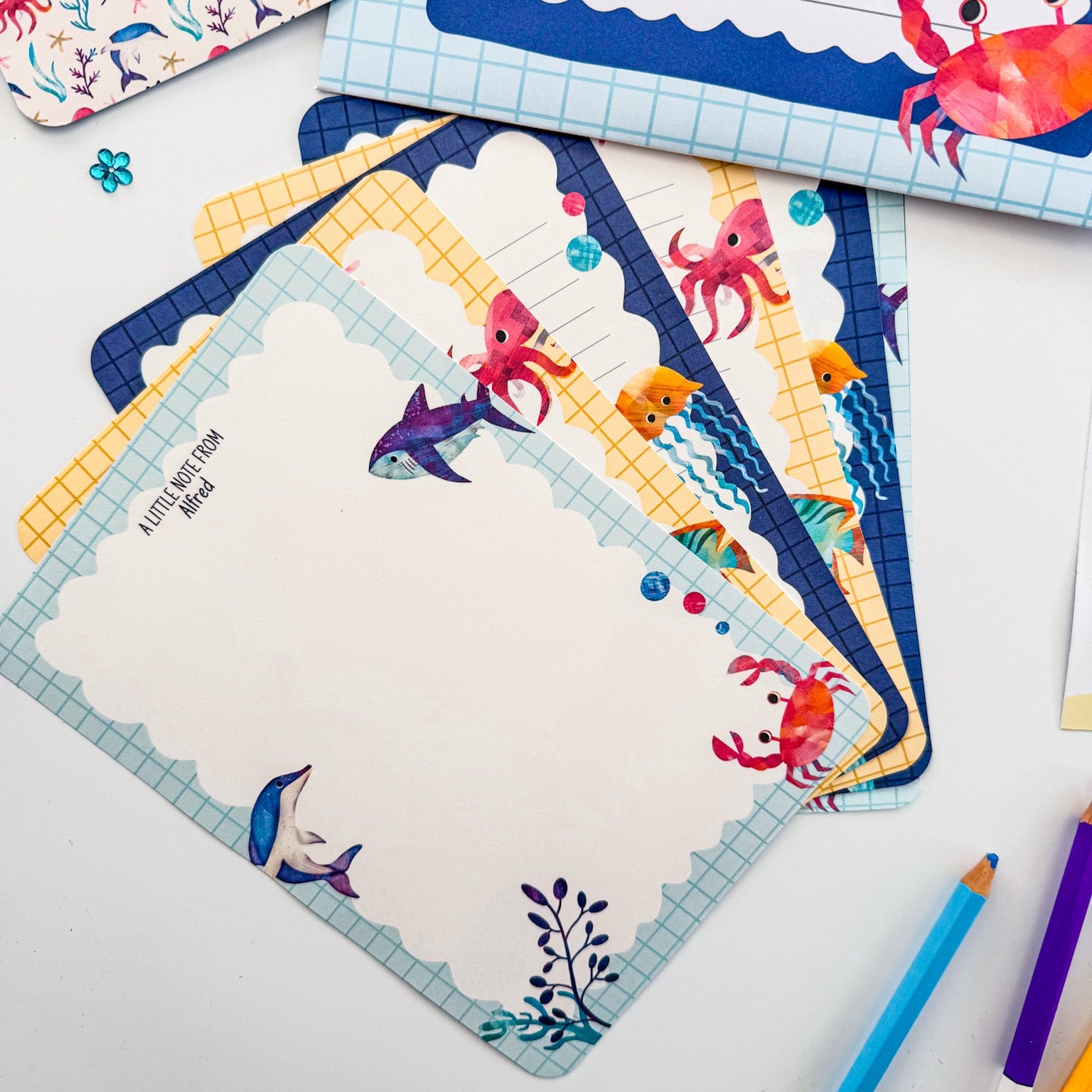 Ocean-themed letter writing paper with playful under-the-sea illustrations.